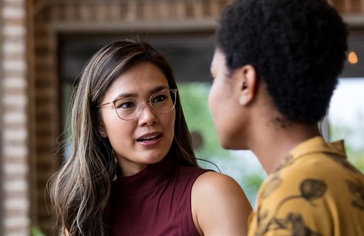 Coach and client fully present and attentive to one another during a face-to-face mindfulness coaching conversation